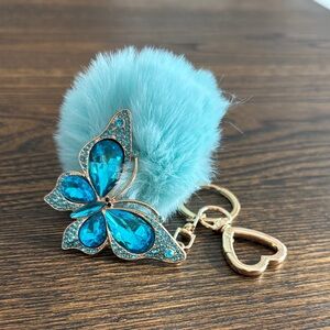 Blue Pom Pom with Butterfly Keychain with Heart Charm